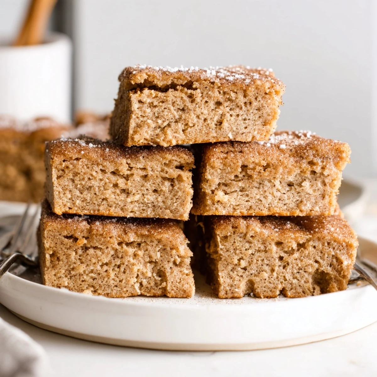 Soft Chai Cinnamon Magdalena Bars, dusted with sugar, perfect for afternoon tea.  