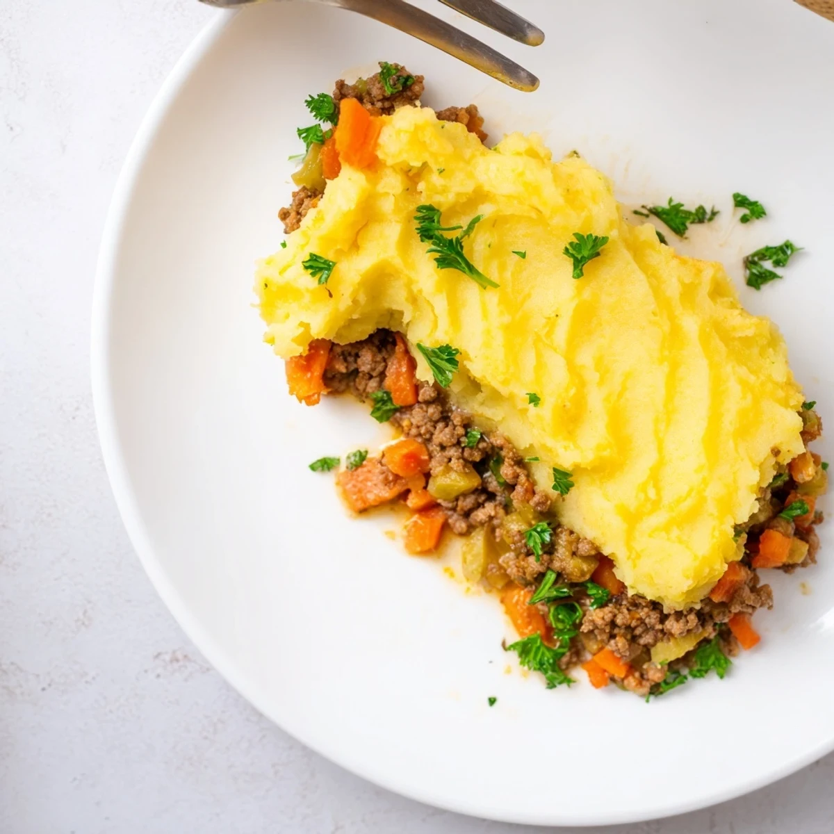 Rustic German Shepherd's Pie with Cheddar Mash, bubbling and golden, a comforting family dinner.