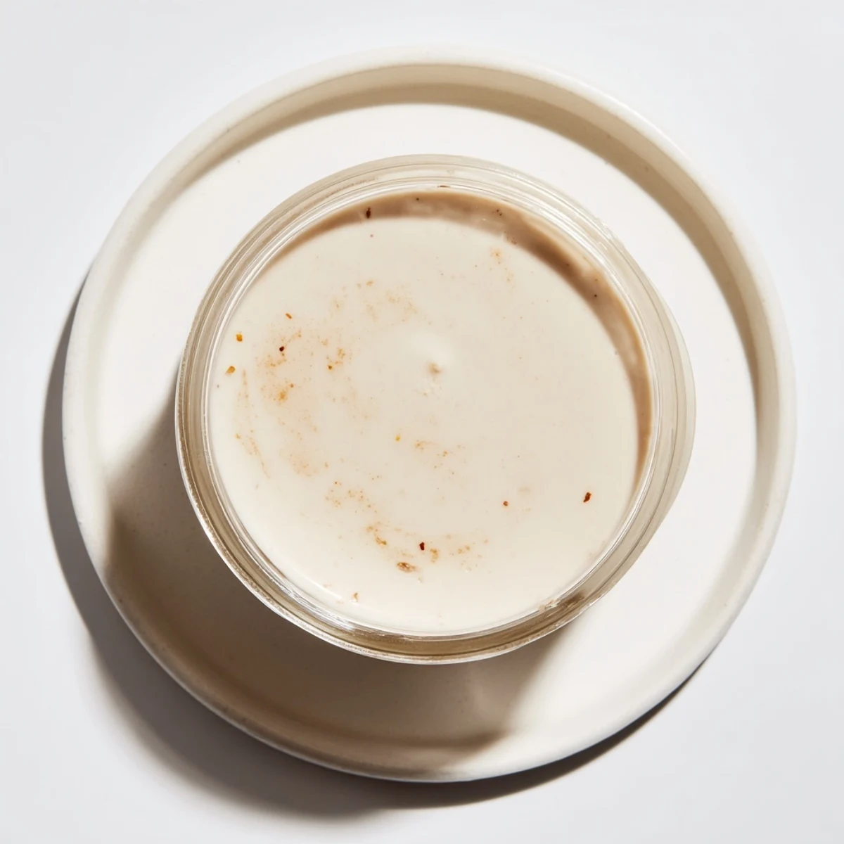 Fresh homemade Express Horchata Concentrate served over ice, a sweet and creamy Spanish beverage.