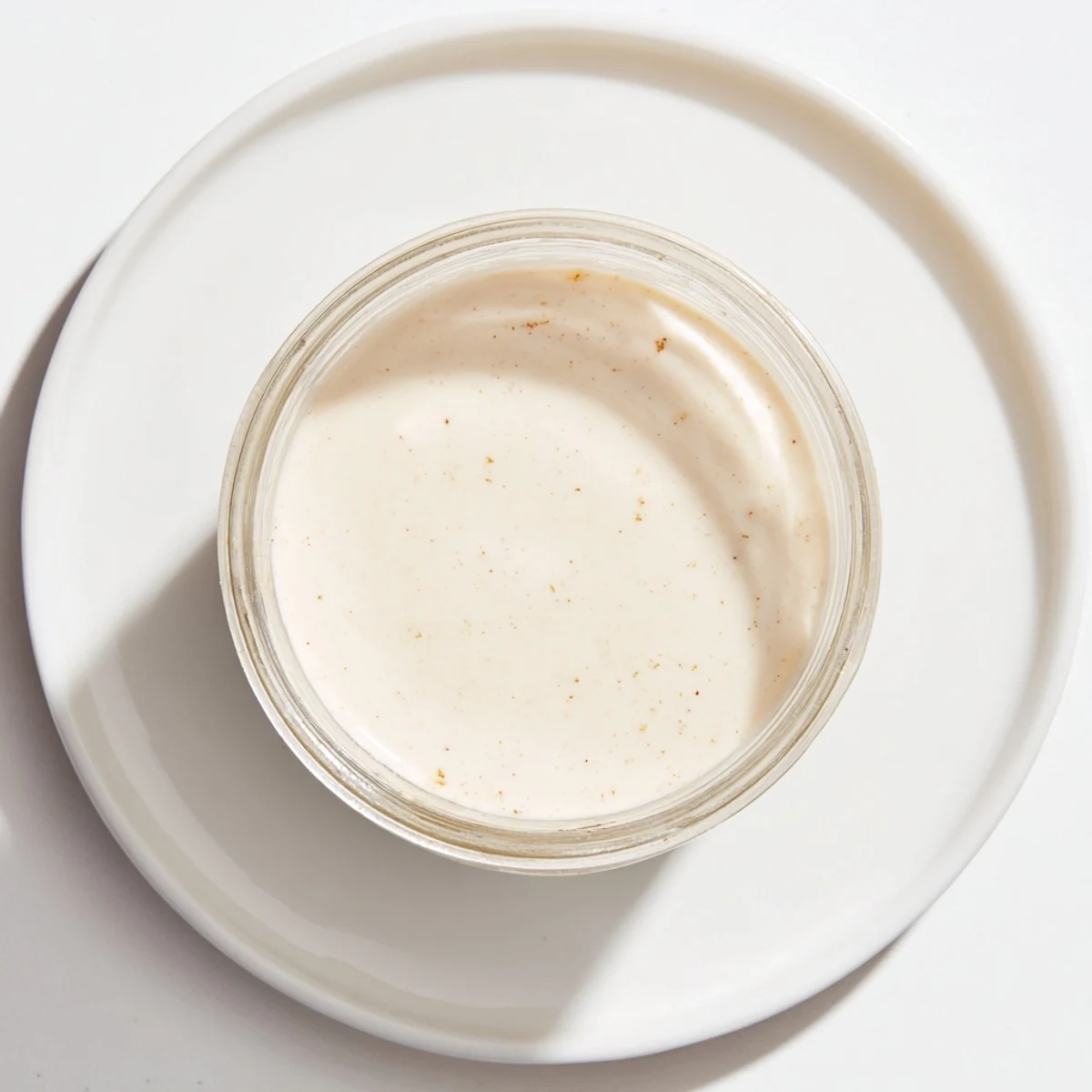 A chilled glass of Express Horchata Concentrate, refreshing dairy-free drink for hot days.