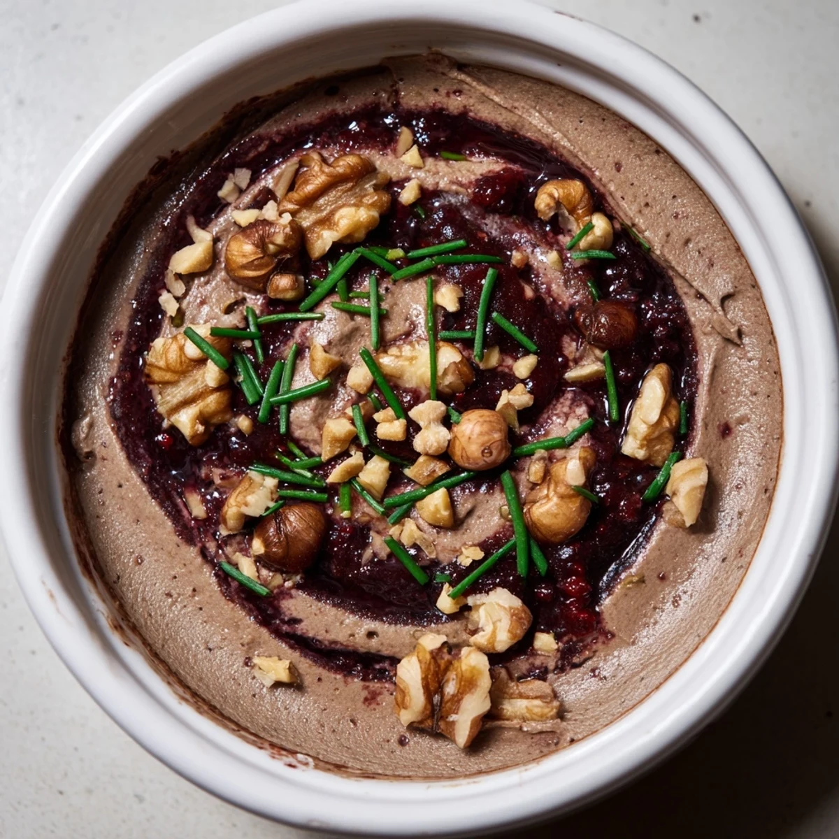 Creamy Velvet Underground appetizer: layers of pâté, sweet jams, and crunchy nuts, ready to serve.