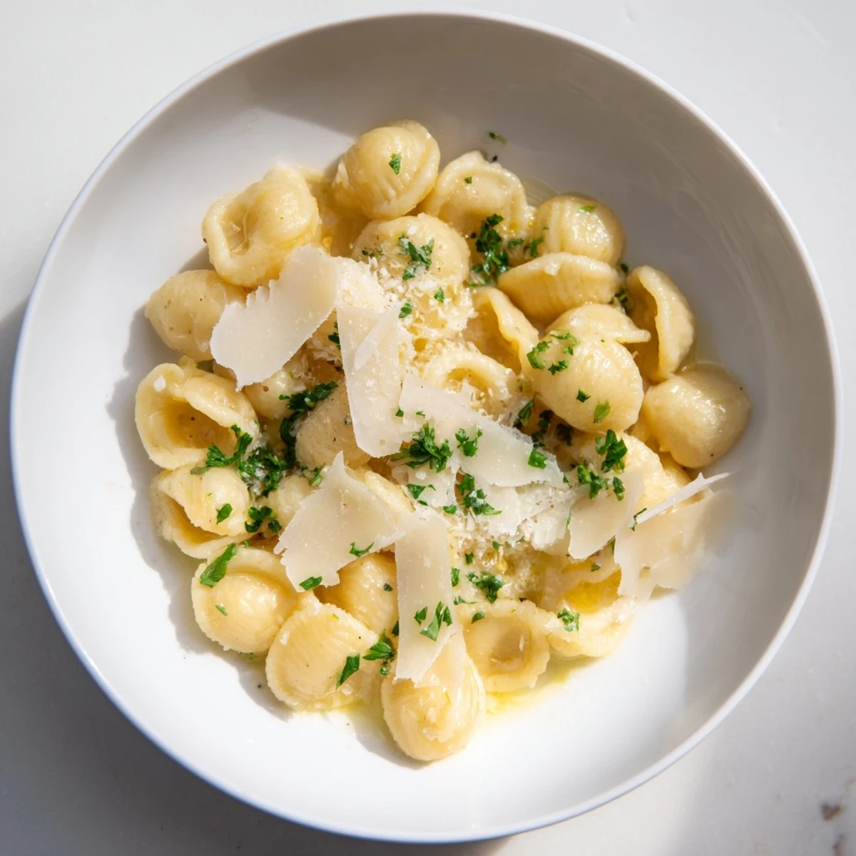 This easy 15-Minute Garlic Parmesan Pasta features perfectly coated pasta with grated Parmesan and herbs.