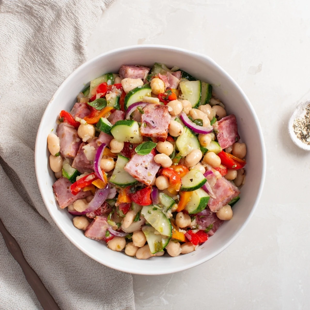 This flavorful Mediterranean Dense Bean Salad with salami is tossed gently in a flavorful dressing.