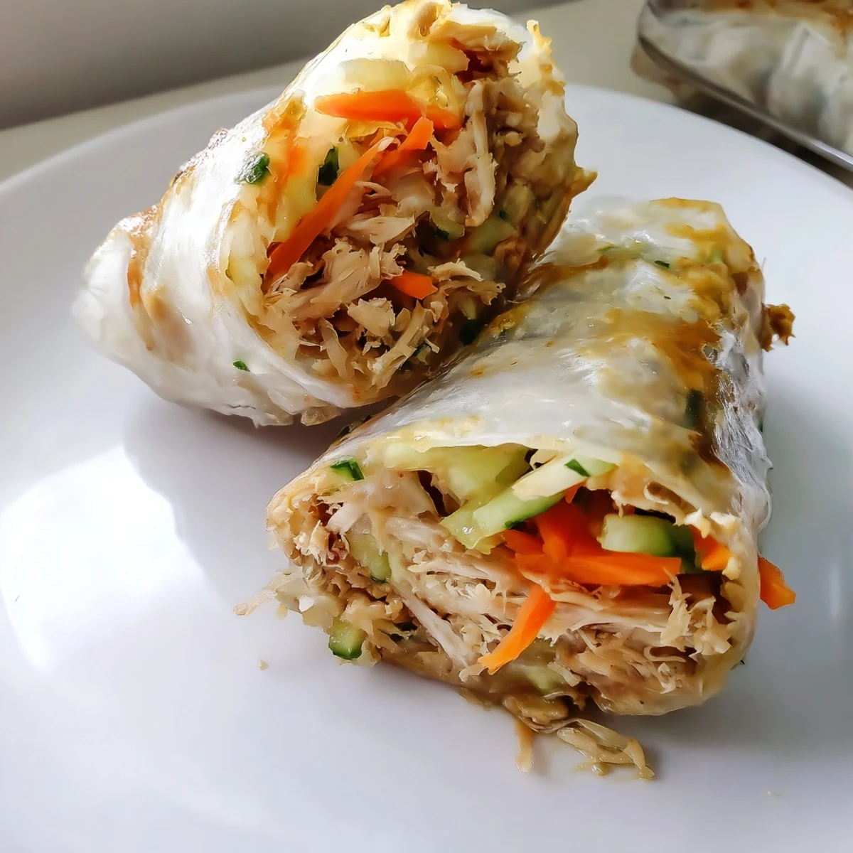 Juicy Garlicky Pulled Chicken Wraps glistening with a rich garlic-butter sauce, ready to be devoured.