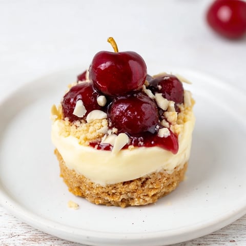 No-Bake Nougat and Cherry Mini Cheesecakes topped with glistening cherries, ready to eat.