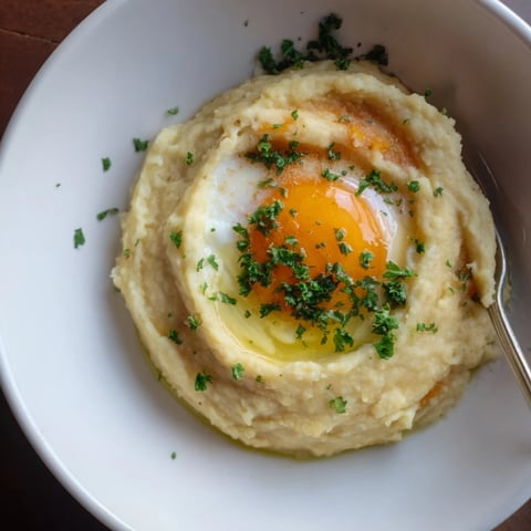 Creamy root vegetable mash topped with a perfectly poached egg, a comforting brunch.