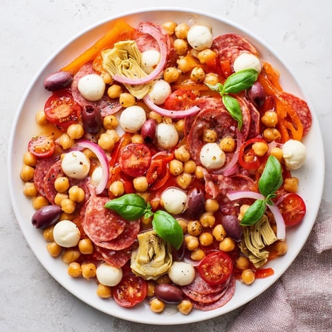 Antipasto Chickpea Salad overflowing with vibrant ingredients, perfect for a light, delicious lunch.