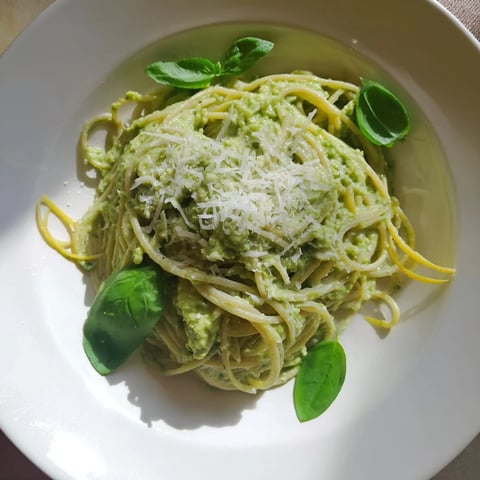 Creamy avocado pasta, a vibrant vegetarian meal, coated in a luscious green avocado sauce.