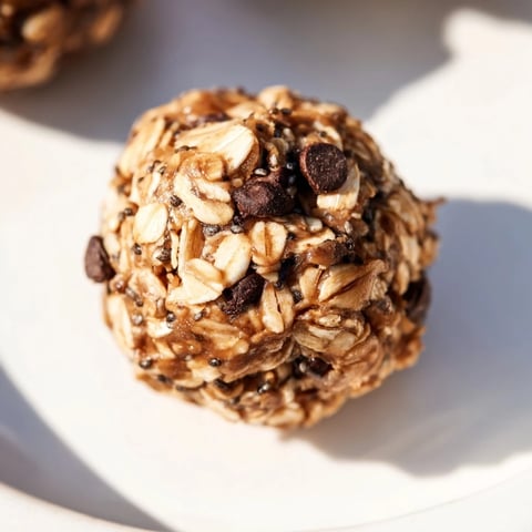 Almond-Chia Energy Bites: a close-up picture of chewy no-bake bites, studded with chocolate chips.