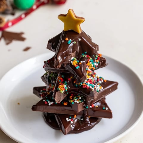 Chocolate Kinder Christmas Trees, a festive treat: chocolate-drizzled Kinder bars, ready for sharing this holiday.