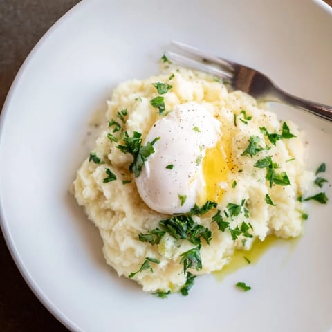 This beautiful root vegetable mash features a sunny poached egg, perfect for dinner.