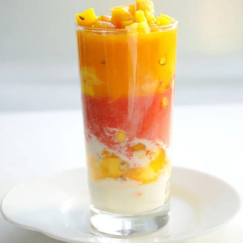 A close-up of a refreshing Tropical Sunset Smoothie, perfect for a summer breakfast.