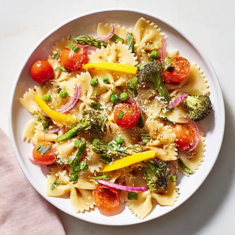 Freshly made Rainbow Veggie Pasta Primavera, featuring seasonal vegetables, ready to be enjoyed.