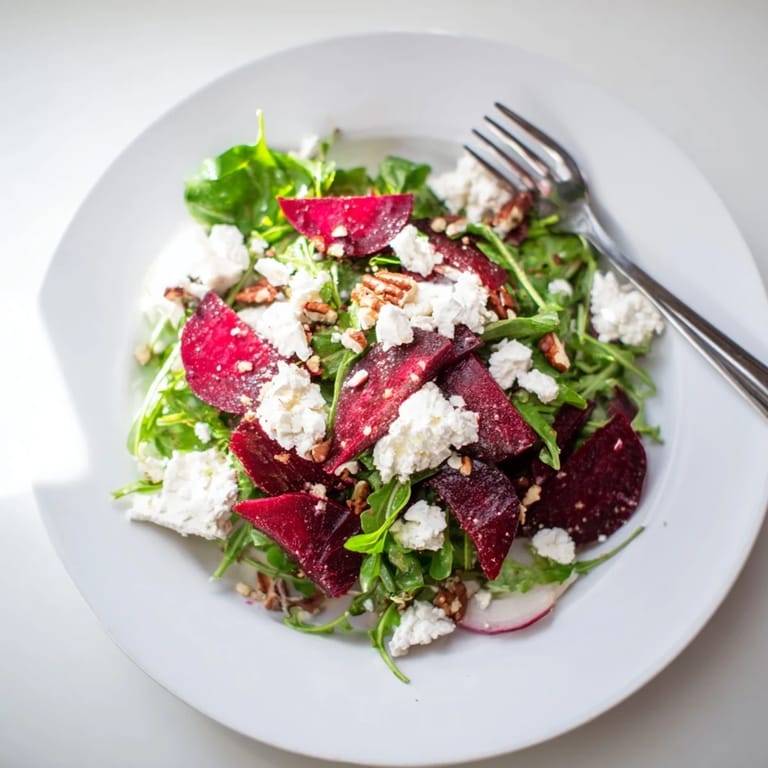 This stunning pickled beet salad with goat cheese showcases colorful beets, balanced flavors, and textures for a delightful meal.