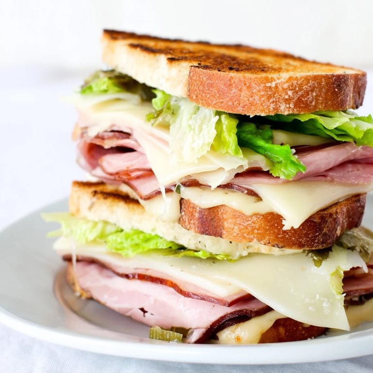 A visually stunning arrangement of Festin du Château Royal Sandwiches with assorted fillings, plated elegantly.