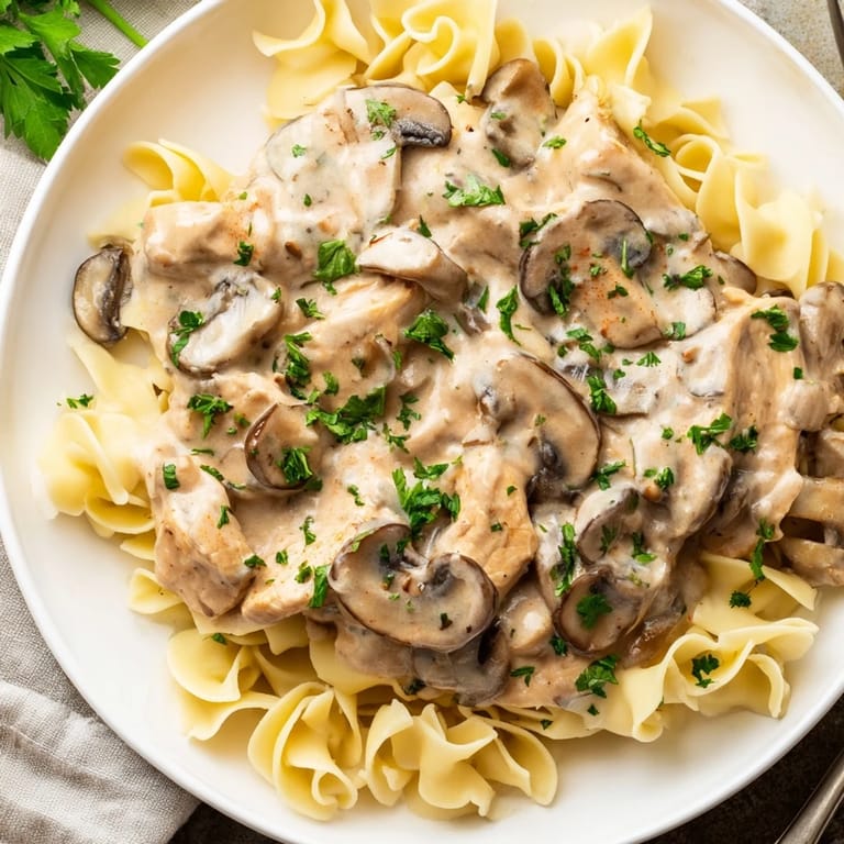 A close-up of Chicken and Mushroom Stroganoff, showing tender chicken and flavorful mushrooms.
