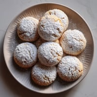 Plate of almond and honey polvorones.