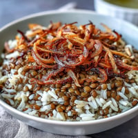 Levantine Mujadara: fluffy rice, earthy lentils, topped with golden crispy onions.